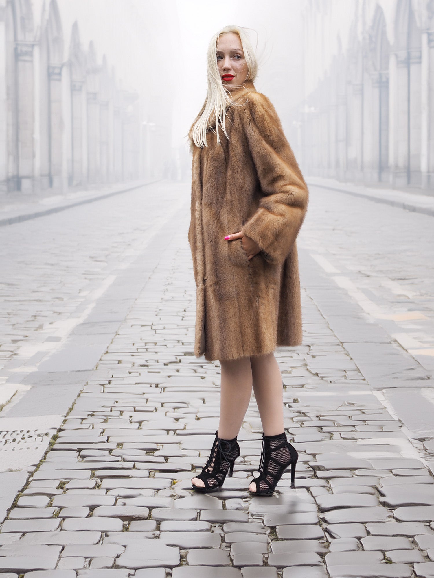 Model poses in classic pastel brown mink fur coat stroller jacket M/L on foggy street. Fully let out mink pelts with luxurious finish.