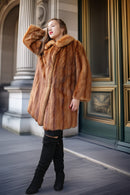 Vintage mink fur coat, caramel-brown, front view with wide lapels and cuffs
