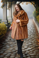 Warm caramel-brown mink fur coat with thick collar and long sleeves, button front