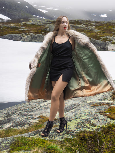 Model showcasing vintage fur coat with open front