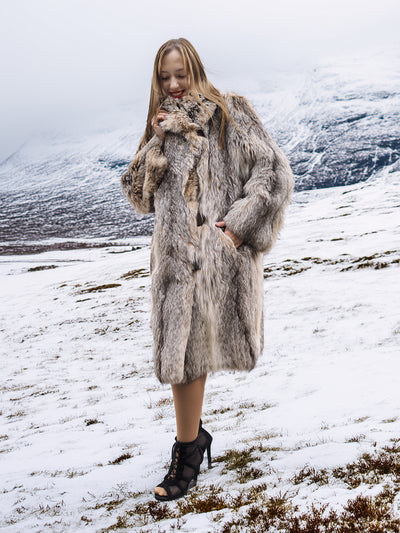 Vintage fur coat with shawl collar in snowy field