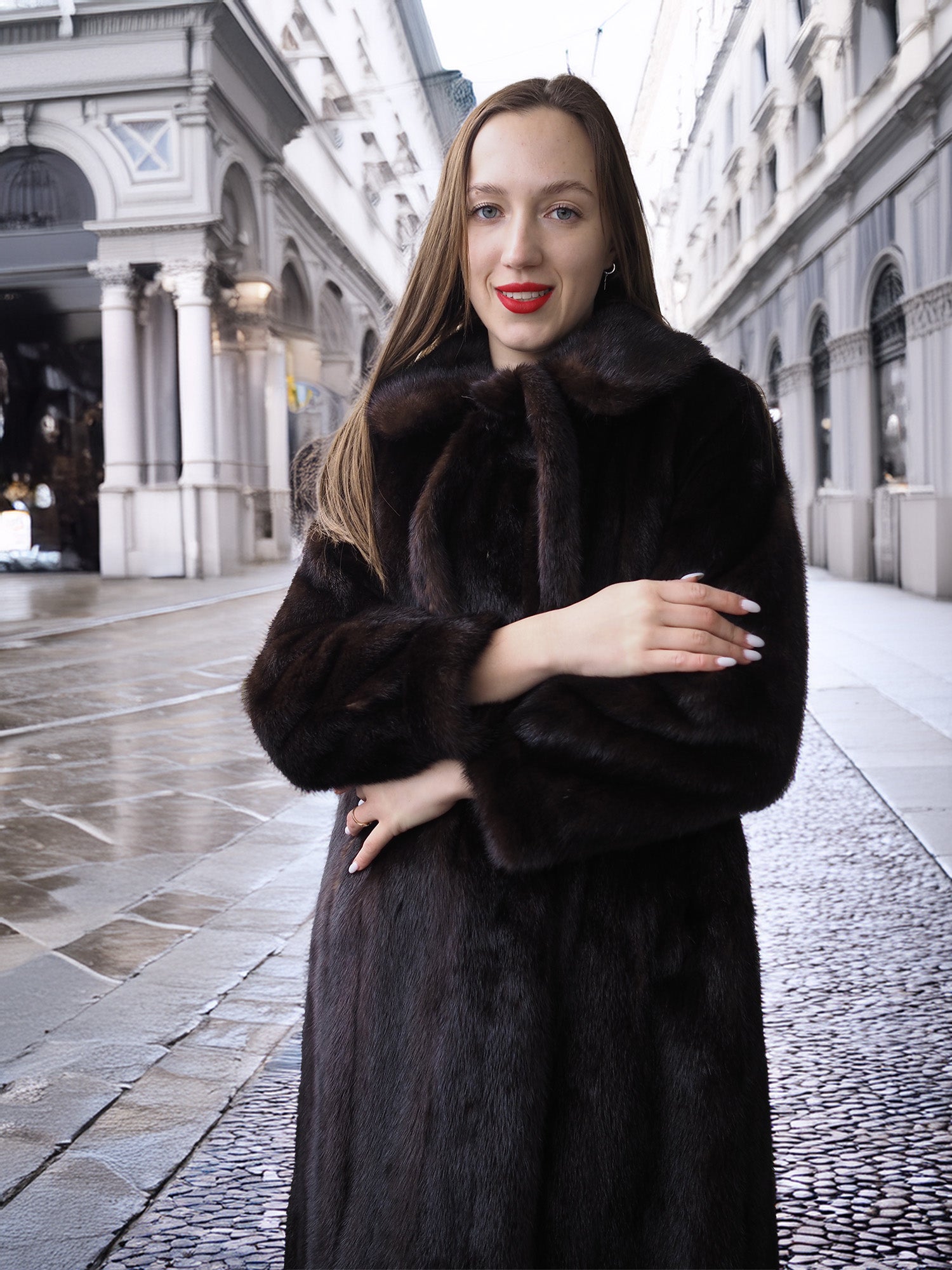 Model in La Galleria mahogany mink fur coat with tie closure, styled in a city setting for sophisticated winter outerwear fashion.