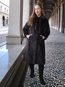 La Galleria vintage mink fur coat in mahogany, styled with black boots and tie-neck detail, perfect for elegant winter looks.