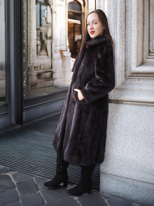 La Galleria vintage mahogany mink fur coat with tie-front, full-length design, styled with black boots for elegant winter fashion.