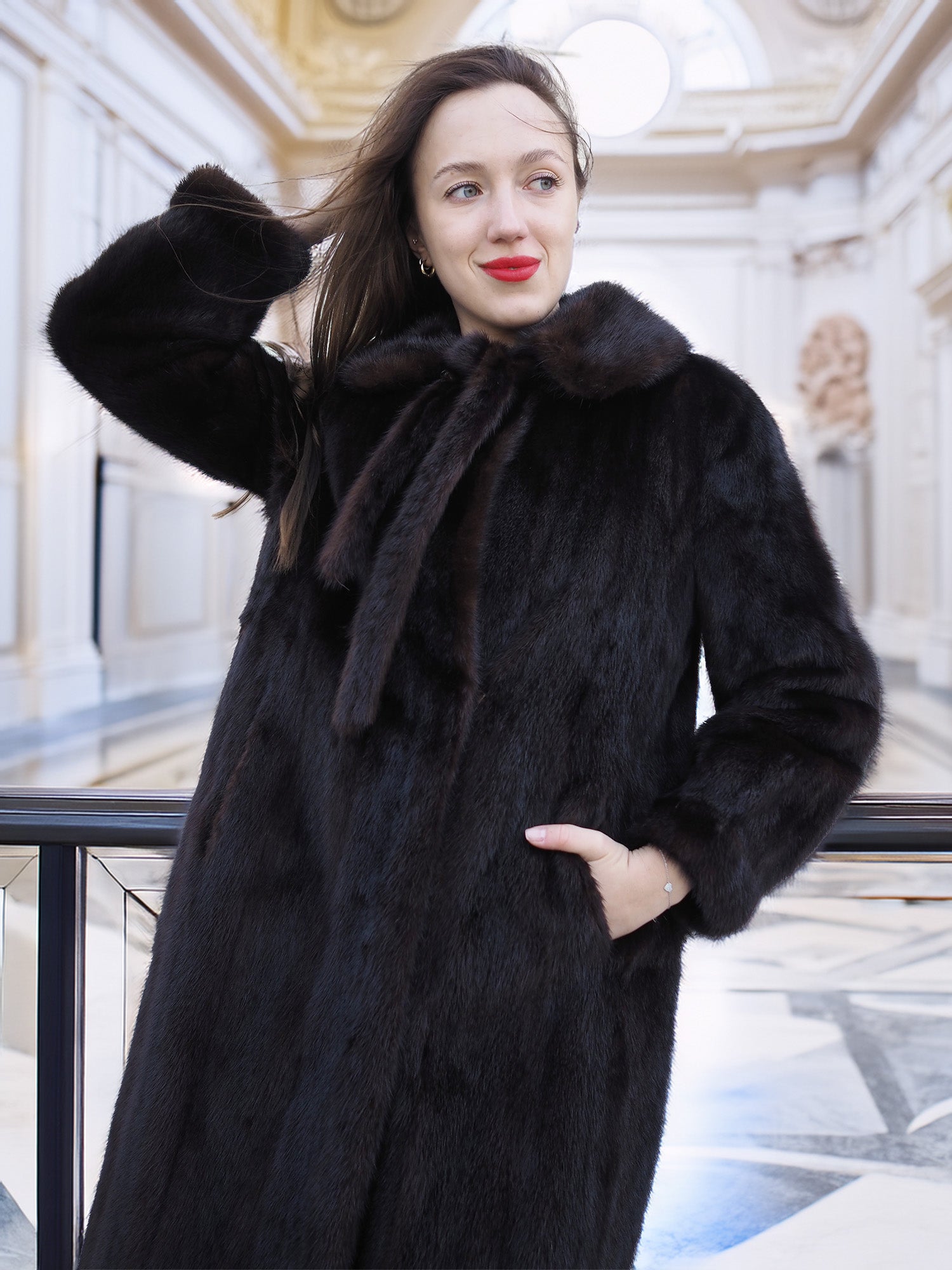 Close-up of La Galleria mahogany mink fur coat with tie-neck, styled for cold-weather elegance and timeless outerwear appeal.