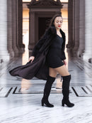 La Galleria vintage mink fur coat in motion, revealing satin interior and luxurious mahogany fur, styled for cold-weather elegance.