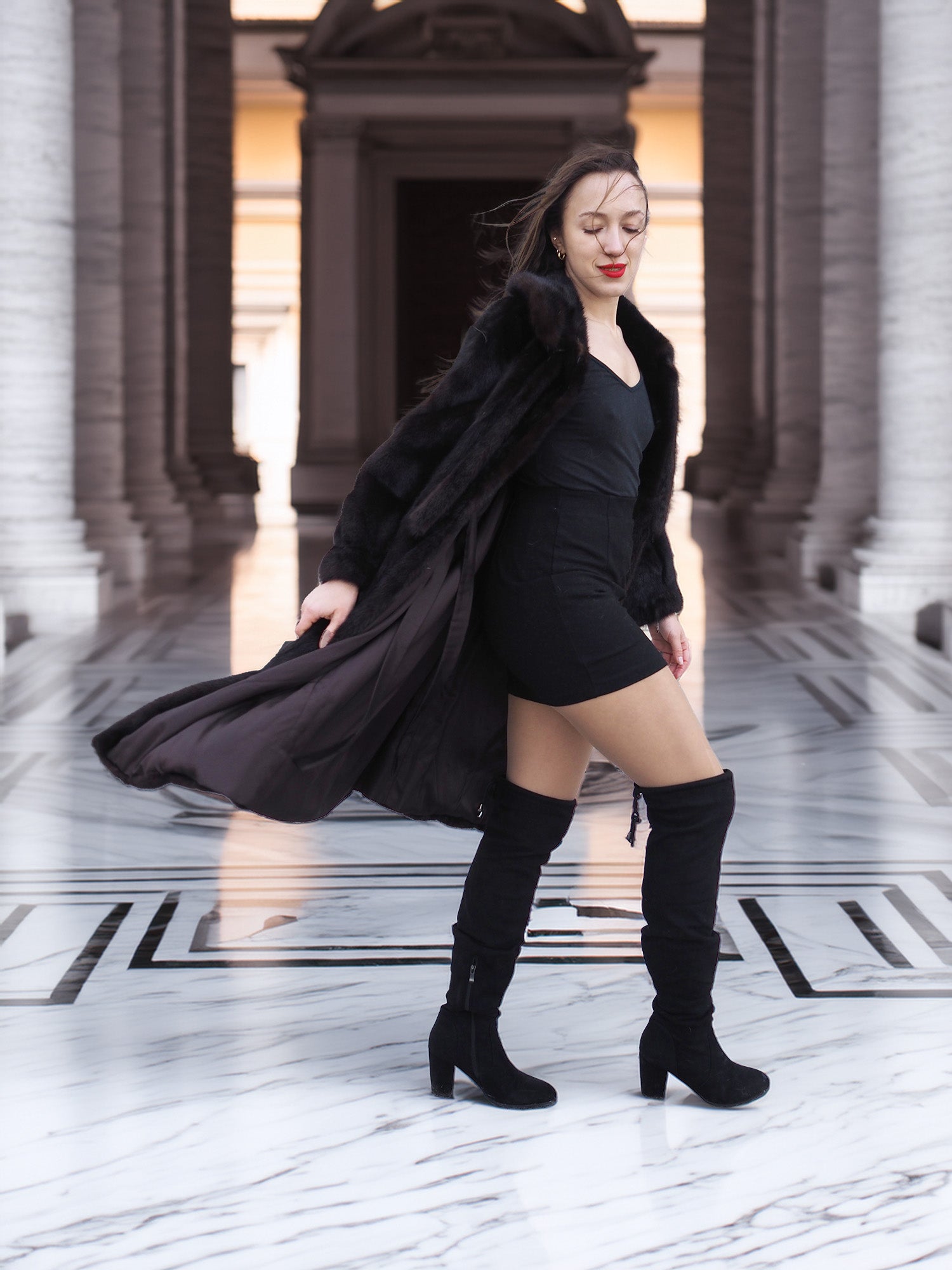 La Galleria vintage mink fur coat in motion, revealing satin interior and luxurious mahogany fur, styled for cold-weather elegance.