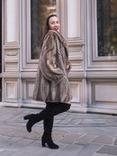 Model turning in Two Tone Mink Fur Jacket L/XL 16, showcasing the jacket’s elegant drape and luxurious fur finish.