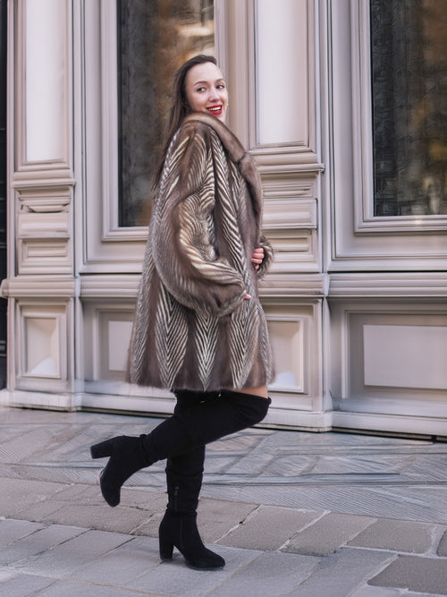 Model turning in Two Tone Mink Fur Jacket L/XL 16, showcasing the jacket’s elegant drape and luxurious fur finish.