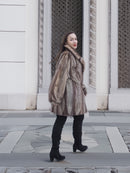 Model turning in Two Tone Mink Fur Jacket L/XL 16, highlighting the jacket’s movement and luxurious fur texture.