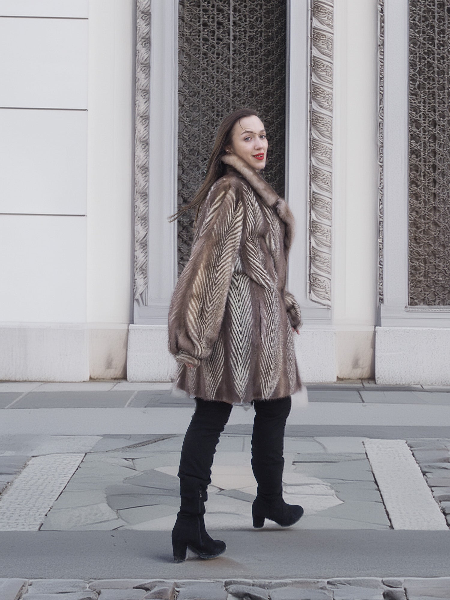 Model turning in Two Tone Mink Fur Jacket L/XL 16, highlighting the jacket’s movement and luxurious fur texture.