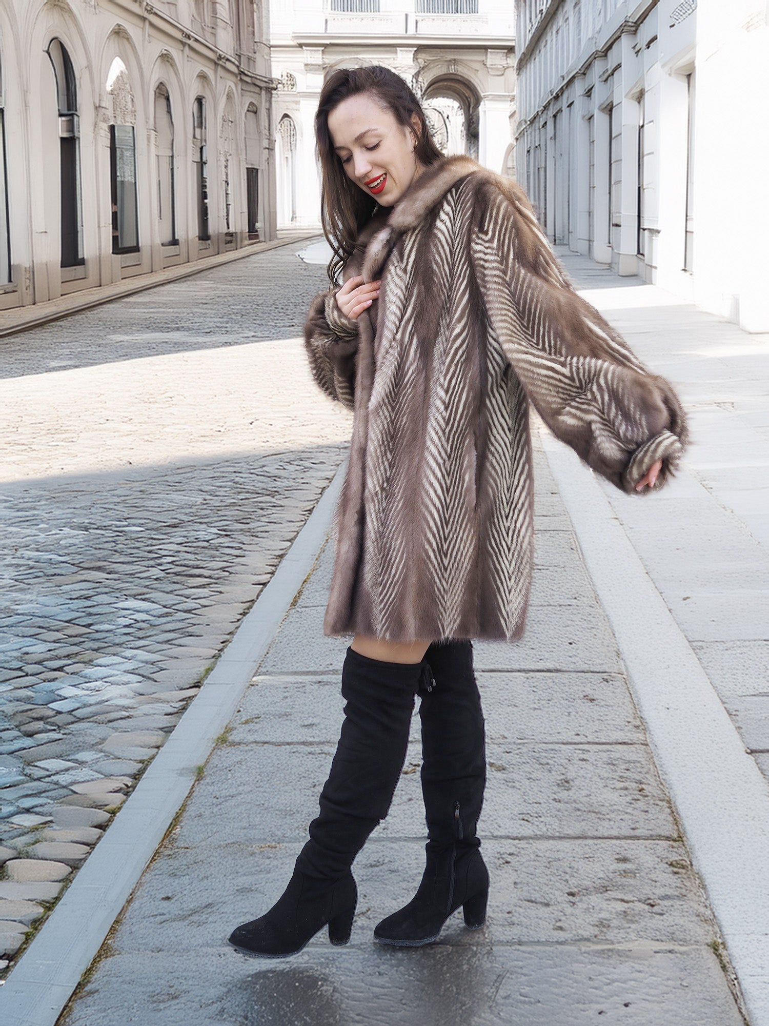 Side view of Canadian Mink Fur Jacket L/XL 16 with soft herring bone design, worn with black boots for a chic winter look.