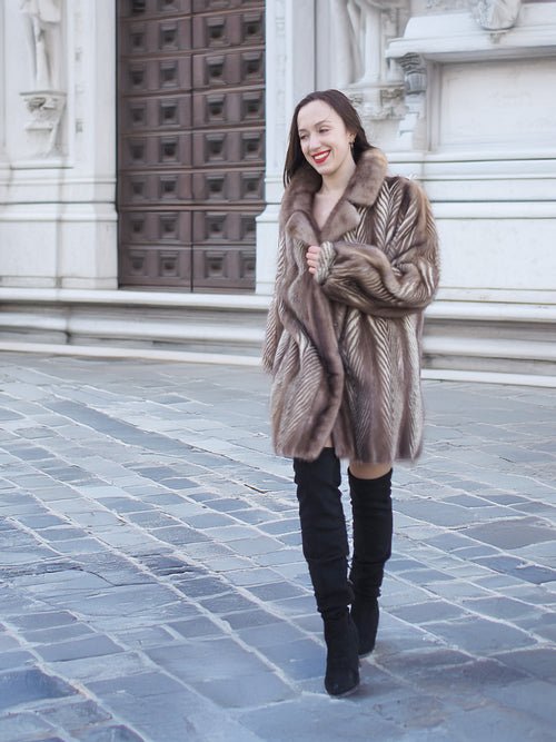 Model walking in Brand New Canadian Mink Fur Jacket L/XL 16 with rich herring bone design and plush texture, ideal for winter fashion.