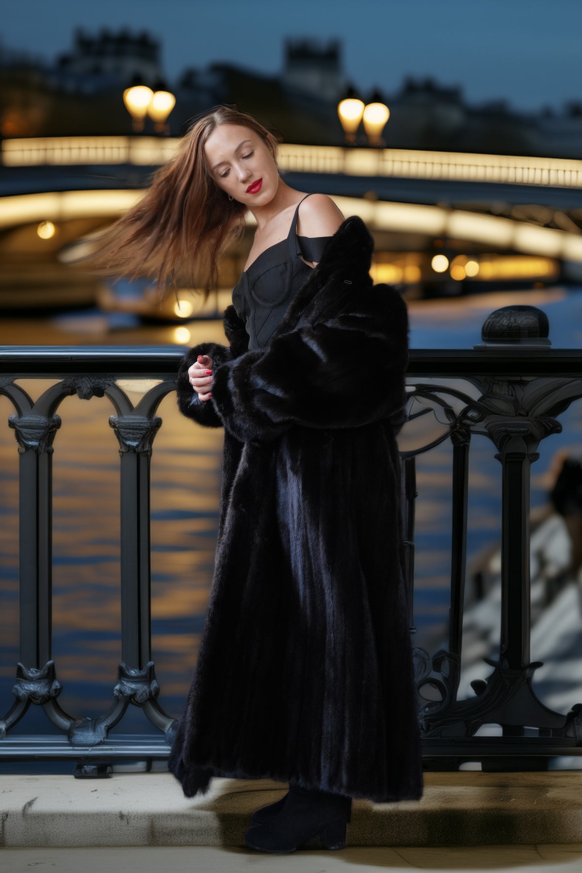 A woman posing on a bridge at night wearing a luxurious black fur coat over a black dress, with the Seine River and illuminated bridge in the background.