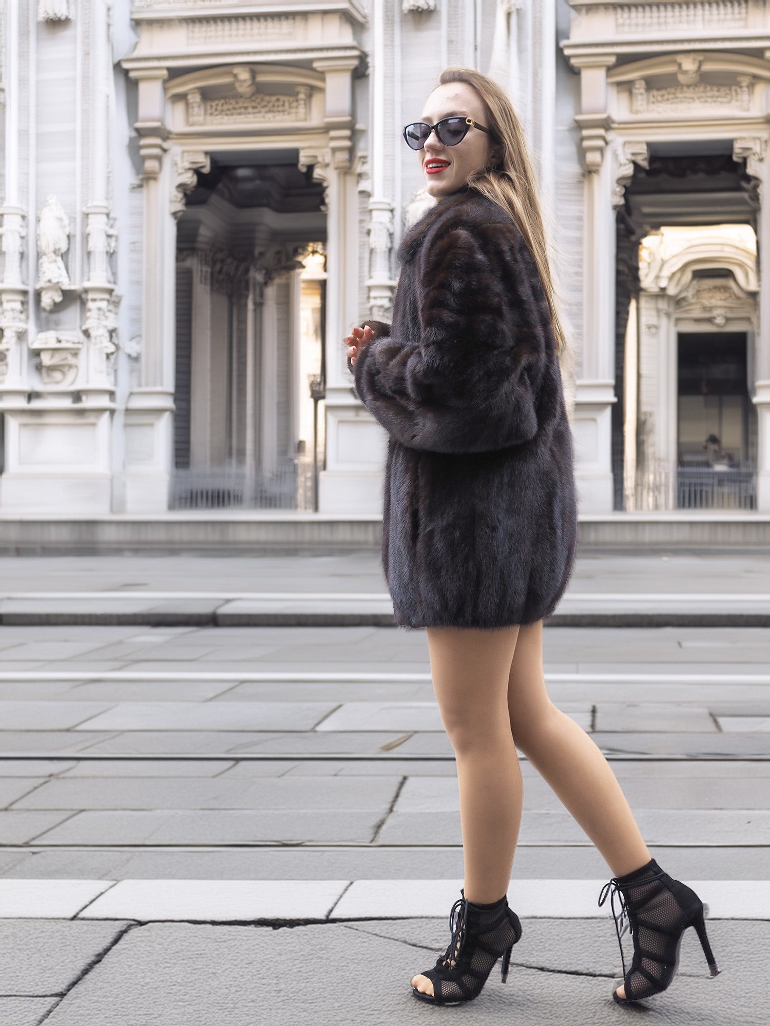 Unisex Dark Mahogany Mink Fur Bomber Jacket Coat M/L styled with heels, showing off its elegant cut and natural fur shine.