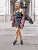 Model twirls in Unisex Dark Mahogany Mink Fur Bomber Jacket Coat M/L, showcasing its burgundy lining and stylish outerwear appeal.