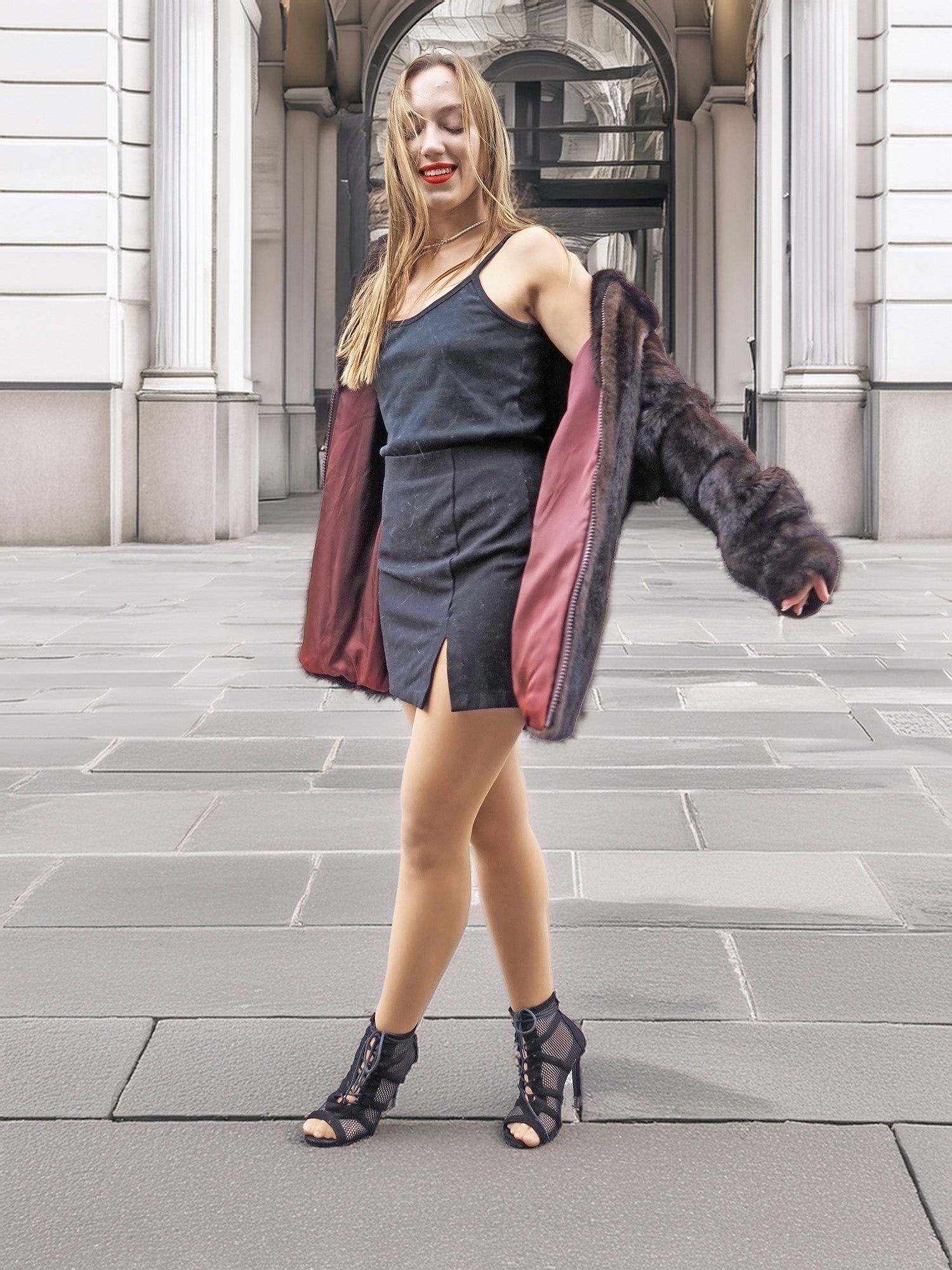 Model twirls in Unisex Dark Mahogany Mink Fur Bomber Jacket Coat M/L, showcasing its burgundy lining and stylish outerwear appeal.