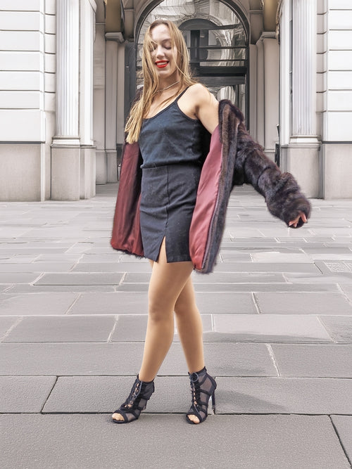 Model twirls in Unisex Dark Mahogany Mink Fur Bomber Jacket Coat M/L, showcasing its burgundy lining and stylish outerwear appeal.