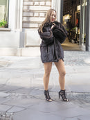 Unisex Dark Mahogany Mink Fur Bomber Jacket Coat M/L styled with black heels, highlighting its luxurious texture and flattering fit.