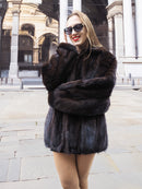 Smiling model in Unisex Dark Mahogany Mink Fur Bomber Jacket Coat M/L, highlighting the coat’s rich color and soft mink texture.