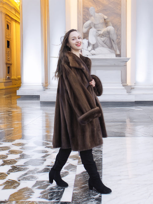 Model walking confidently in Brand New Luxurious Demi Buff Swing Canadian Mink Fur Coat L/XL, highlighting its luxurious drape.