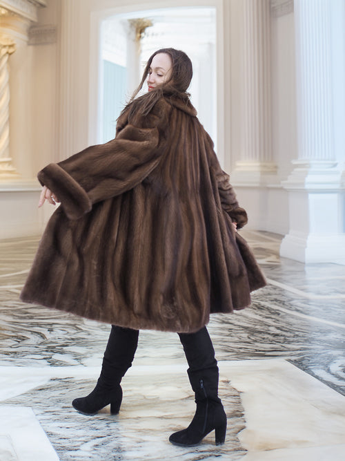 Back twirl of Brand New Luxurious Demi Buff Swing Canadian Mink Fur Coat L/XL, showcasing its voluminous swing and natural fur sheen.
