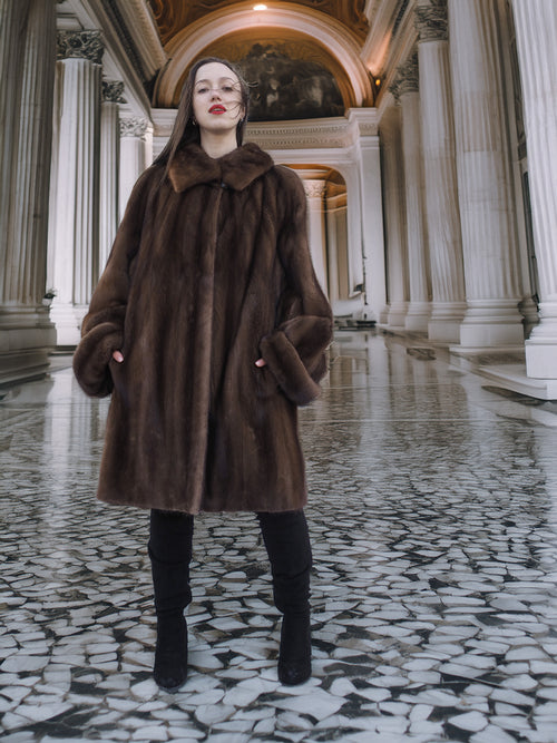 Front view of Brand New Luxurious Demi Buff Swing Canadian Mink Fur Coat L/XL, displayed in a classic architectural setting.