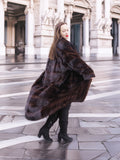 Elegant mahogany mink fur coat with a dramatic silhouette, exuding sophistication and warmth. A timeless winter essential.