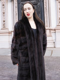 Elegant mahogany mink fur coat featuring a tuxedo collar and rich horizontal design. A timeless luxury piece for cold-weather sophistication.