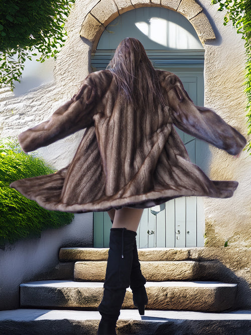 Person wearing a fur coat standing on stone steps with a stone archway and green door in the background.