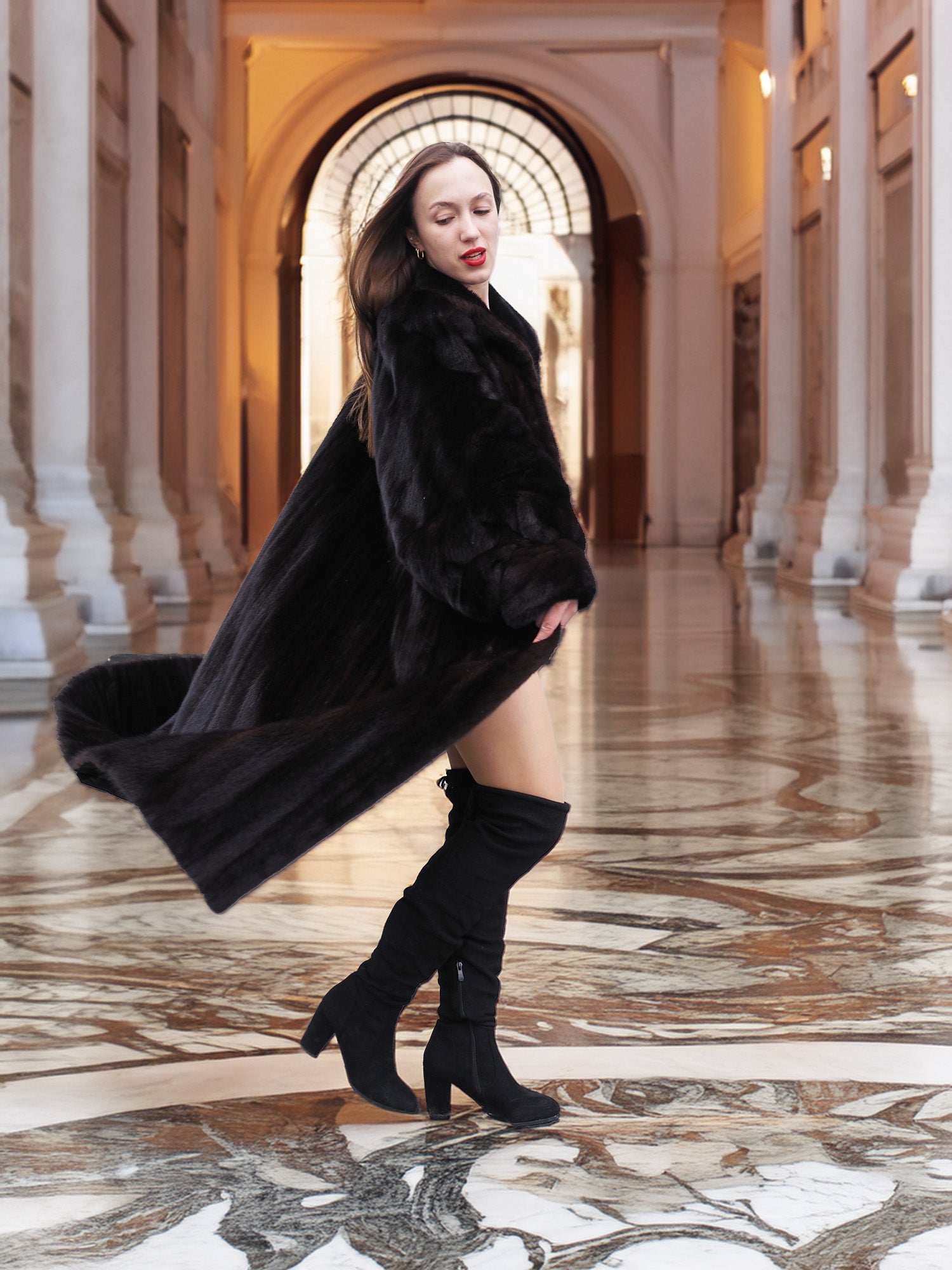 Luxury black mink coat in motion, highlighting its dramatic sweep and rich texture, ideal for upscale winter fashion statements.