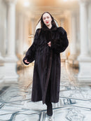 Model walks confidently in full-length black mink fur coat, showcasing cinematic elegance and modern allure in luxury outerwear.