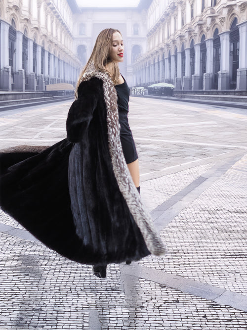 Dynamic spin in black mink coat with silver fox trim, highlighting the coat's volume and elegant lining.