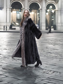 NAFA female black mink coat with indigo fox collar and sleeves in L/XL, styled outdoors with elegant black boots for winter fashion.