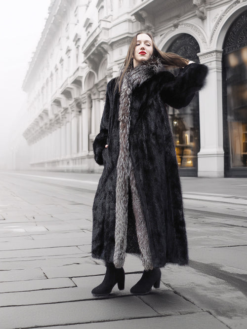 Full-length black mink coat with indigo fox collar, ideal for luxury winter fashion in medium to large sizes.