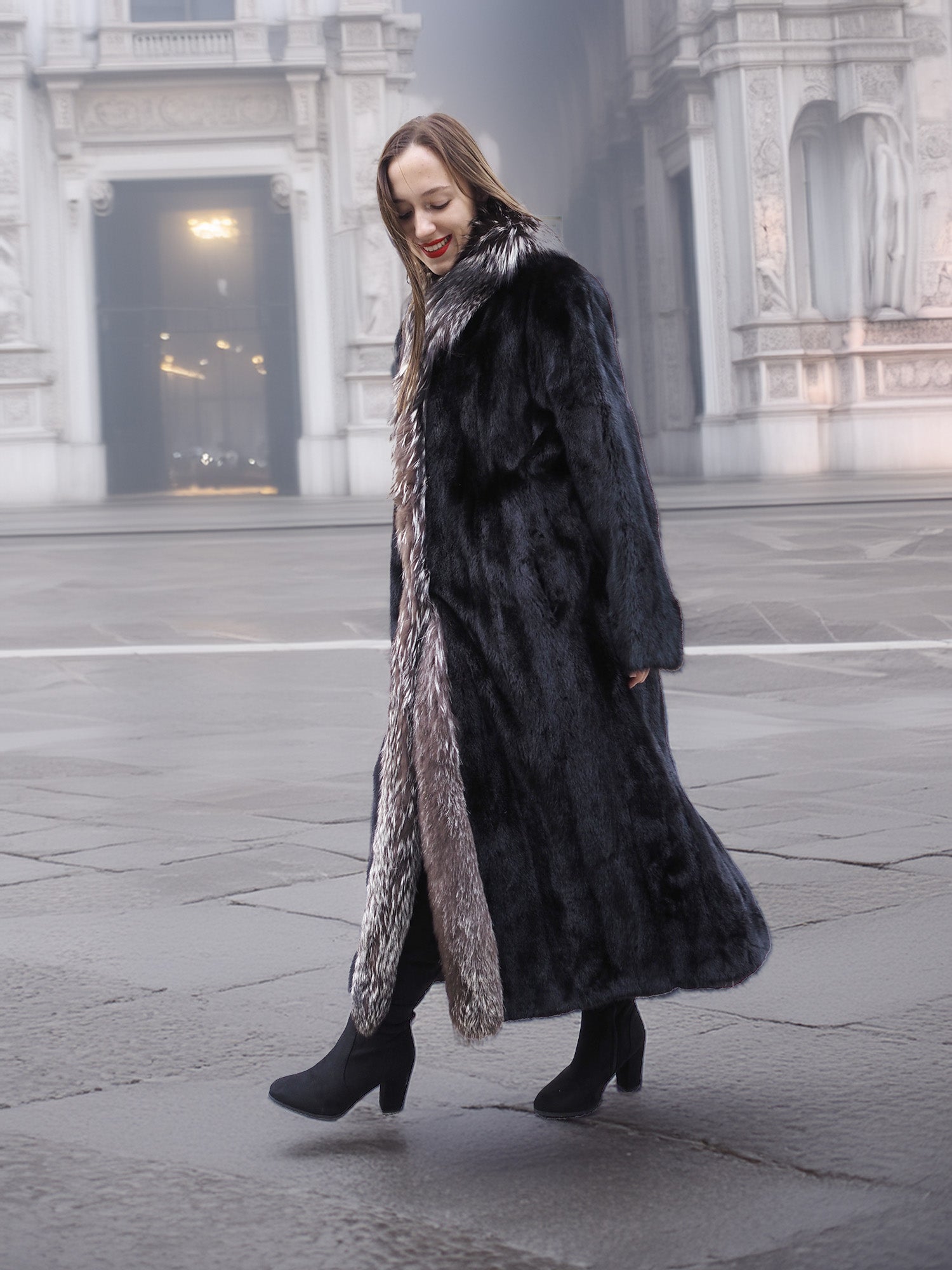 Walking pose in black mink coat with indigo fox collar, showcasing movement and luxurious fur texture for winter fashion.