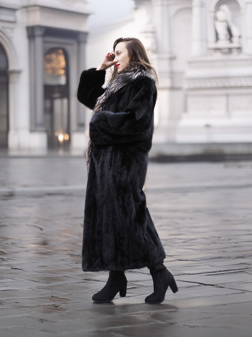 Luxurious black mink coat with silver fox collar in L/XL, shown in side profile highlighting plush fur texture and full-length design.