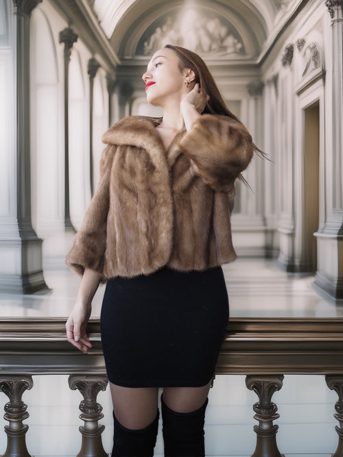 Woman wearing a fur coat in an elegant interior setting