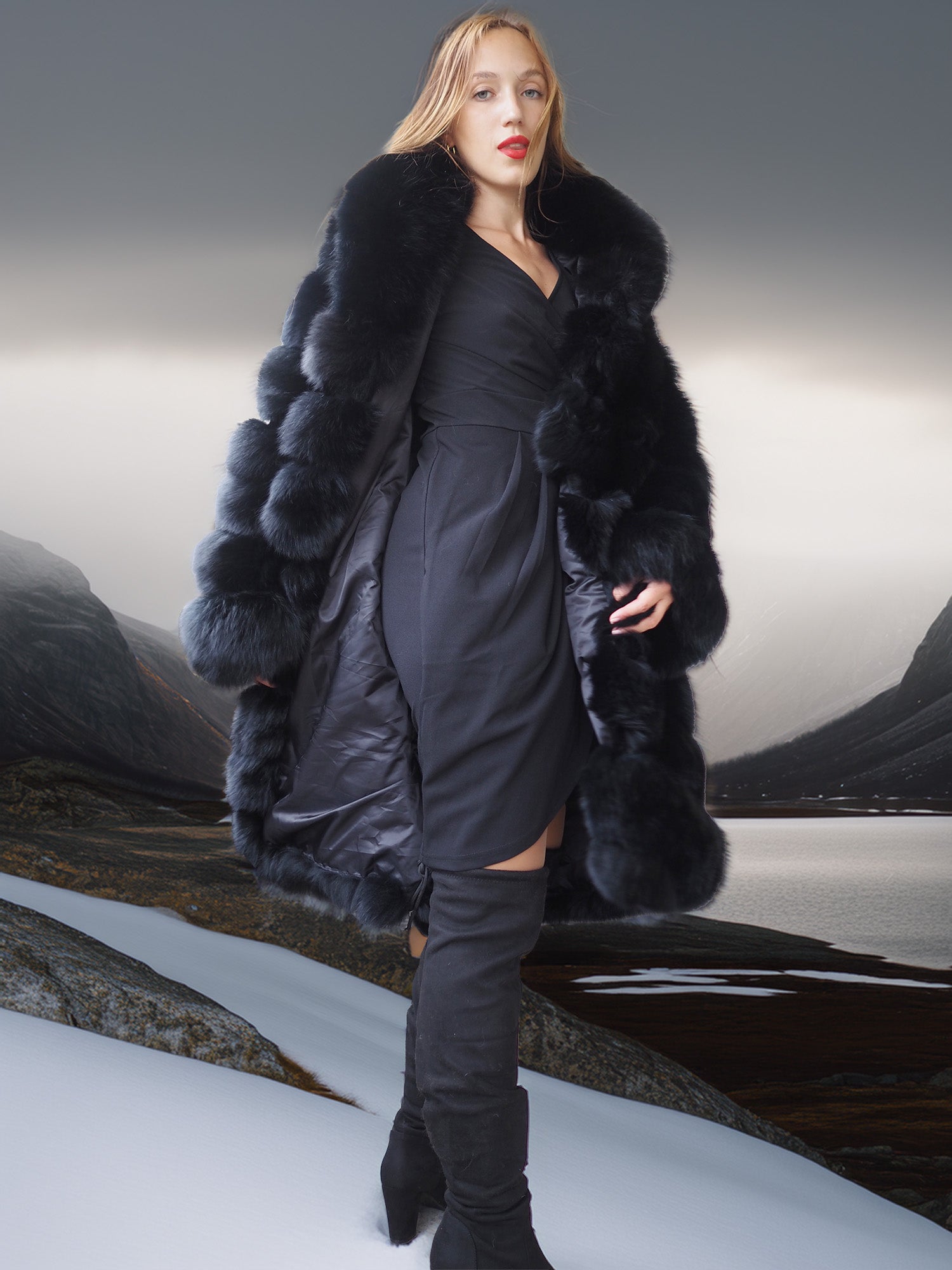 Woman wearing a long black fur coat over a dark outfit on a neutral background