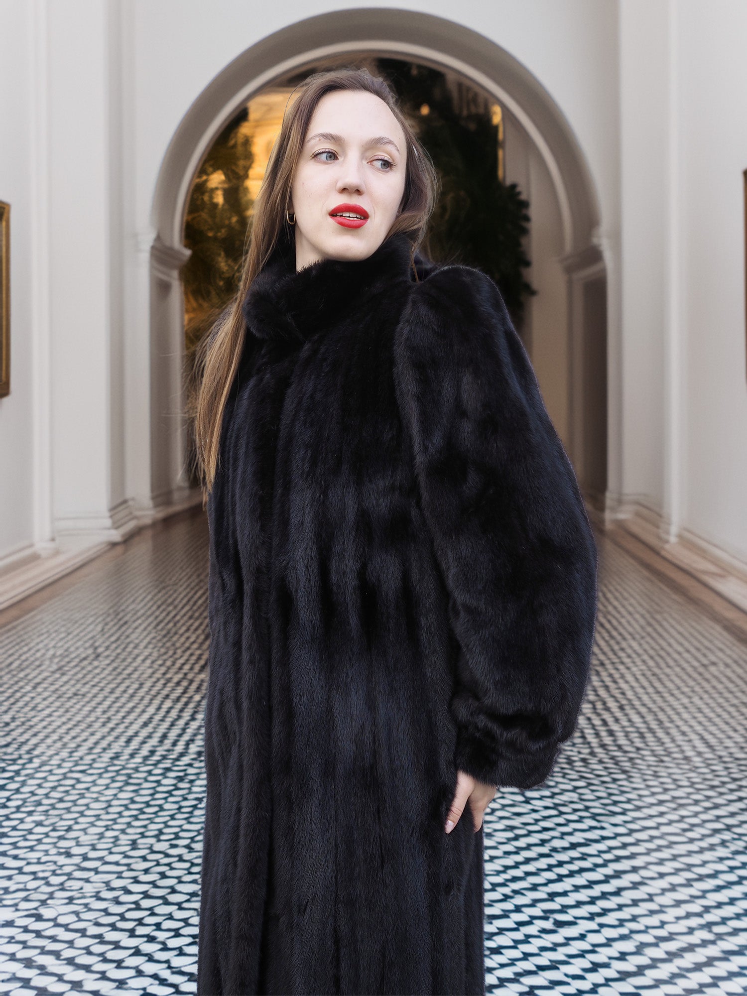 Close-up of black mink fur coat with high collar and plush finish, perfect for elegant winter fashion. Premium fur outerwear, size M.