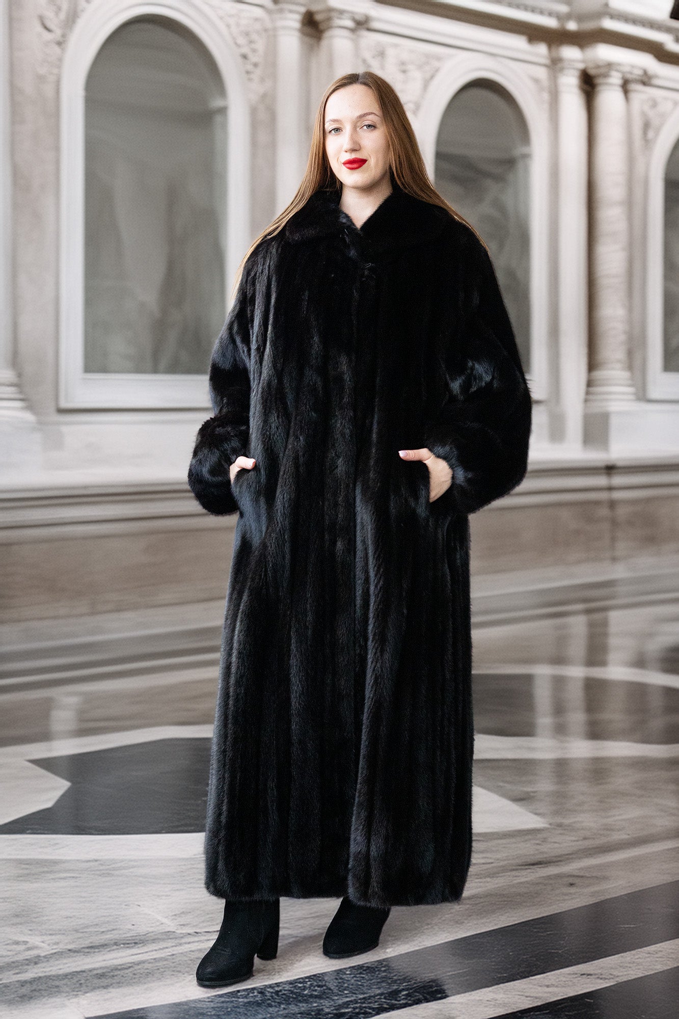 Woman wearing a long black fur coat in an elegant interior setting