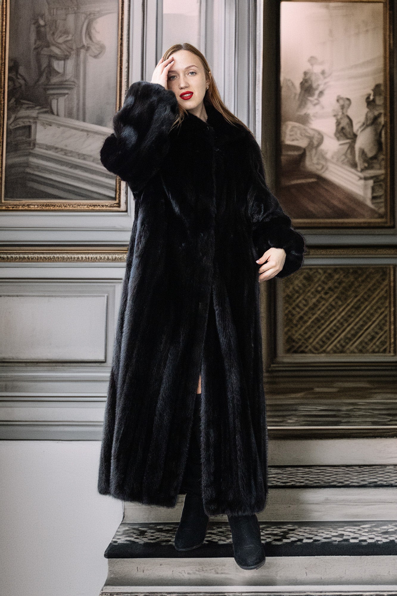 Woman wearing a black fur coat standing on a staircase with classical wall decorations.