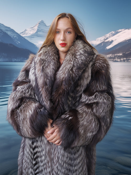 Woman wearing a fur coat with a mountainous landscape in the background