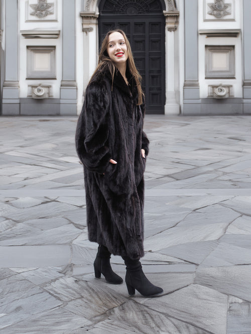 Model wearing a full-length black mink fur coat with a soft sheen, perfect for upscale winter outerwear fashion.