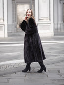 Dark ranch black mink fur coat styled with heeled boots, ideal for luxury outerwear and timeless winter fashion.
