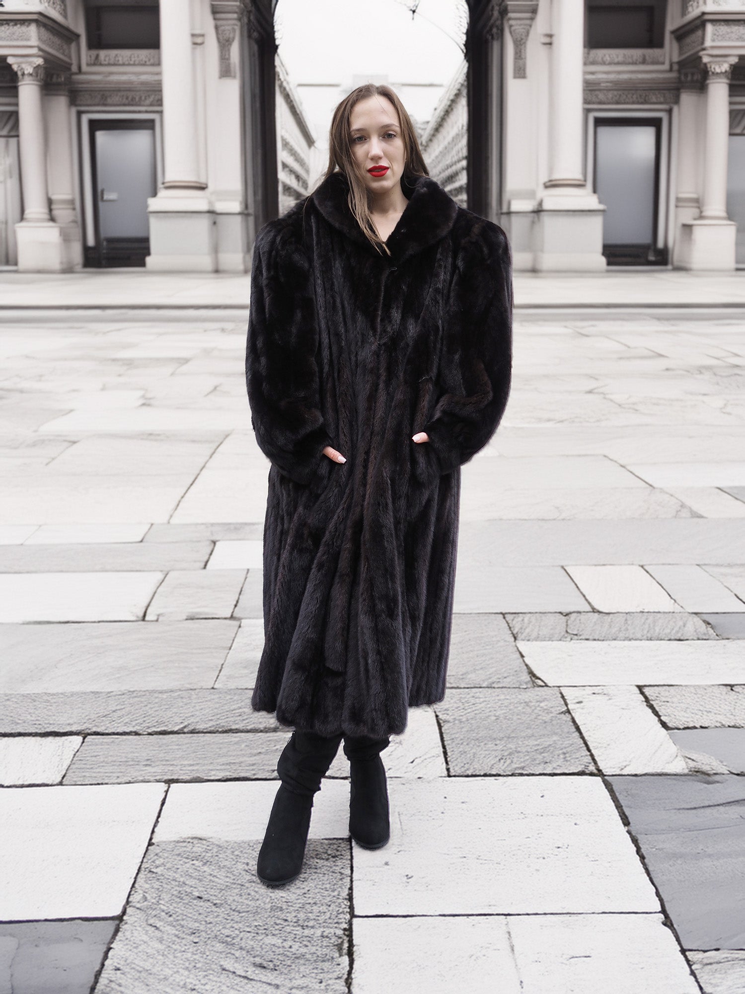 Elegant black mink fur coat with a structured collar and flowing hem, styled for sophisticated winter fashion.