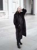 Plush black mink fur coat in XL/XXL size, styled for cold weather luxury with a relaxed and elegant fit.