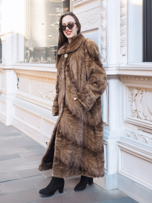 Espresso Mink Long Coat - Regal Swing styled casually against a building, highlighting coat’s length and soft fur texture.