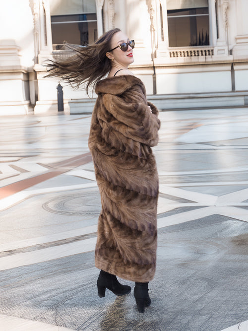Espresso Mink Long Coat - Regal Swing twirling to reveal fur movement and espresso tones in a grand architectural setting.