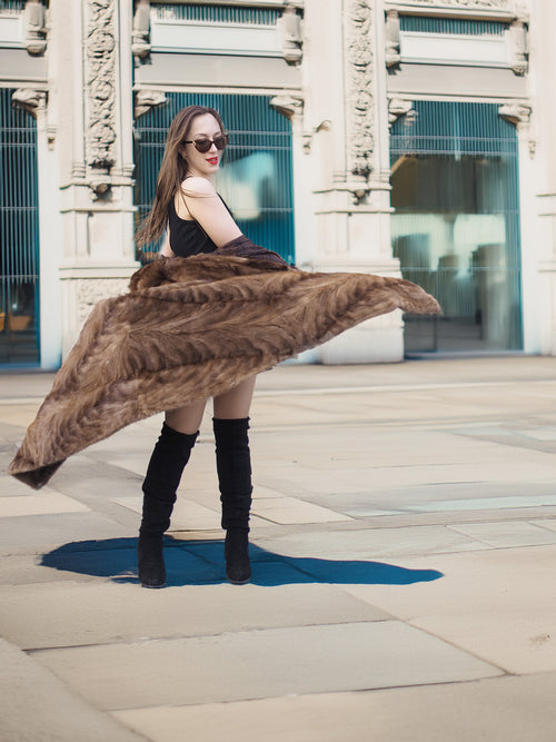 Espresso Mink Long Coat - Regal Swing flaring open mid-spin, styled with black mini dress and boots for dramatic winter fashion.